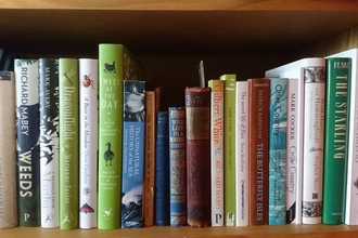 Bookshelf with a selection of nature-themed books (by Wendy Carter)