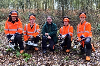 Winter trainee team with chainsaws 