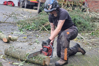 Josie practicing with her chainsaw