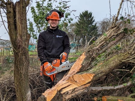 Trainee Matt with a chainsaw