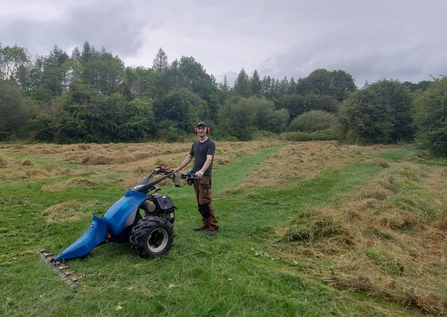 Matt mowing in the summer