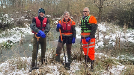 Conservation trainees stood by the Monkwood pond